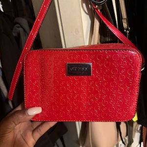Red Guess purse and I’m selling it because I’m decluttering.